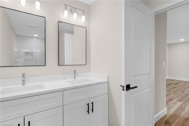 3630 Old Vineyard Rd, Winston-Salem, NC 27104 - full bathroom with double vanity, wood finished floors, baseboards, and a shower