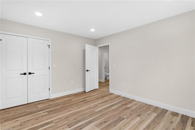 3630 Old Vineyard Rd, Winston-Salem, NC 27104 - unfurnished bedroom with baseboards, light wood finished floors, a closet, and recessed lighting