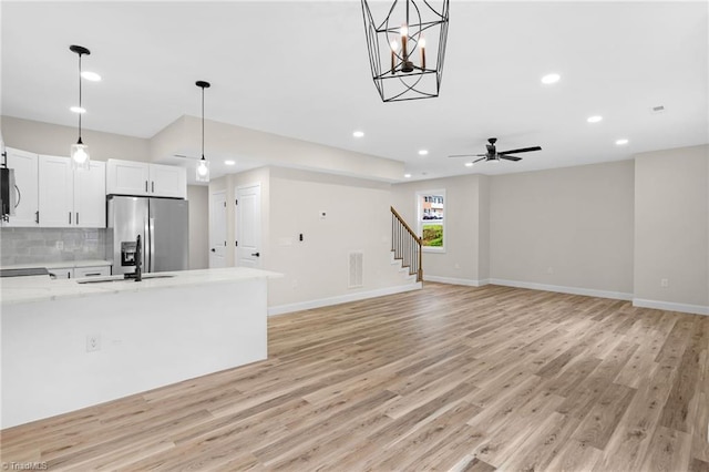 3630 Old Vineyard Rd, Winston-Salem, NC 27104 - unfurnished living room featuring a sink, light wood-type flooring, baseboards, recessed lighting, and a ceiling fan