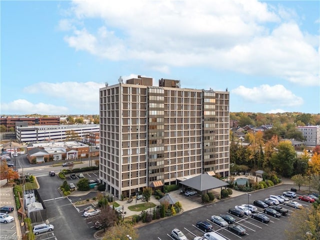 1101 N Elm St Unit 904, Greensboro, NC 27401 - view of building exterior with uncovered parking