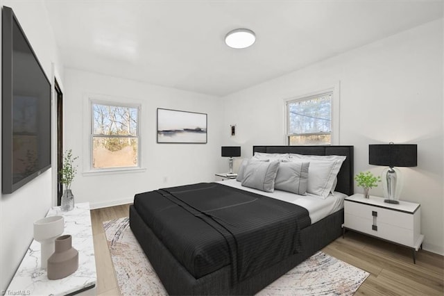 bedroom with light hardwood / wood-style flooring