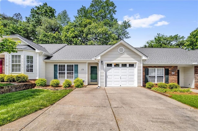 ranch-style home featuring concrete driveway, a garage, a shingled roof, and brick siding