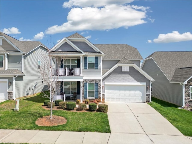 craftsman-style home with a balcony, a garage, covered porch, and a front lawn