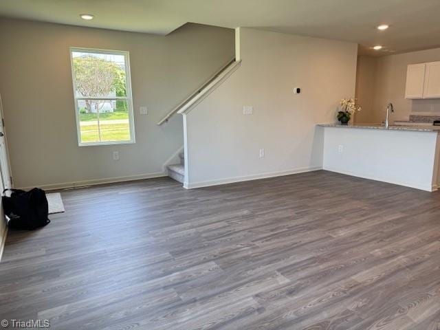 2210 Cranberry Way, Salisbury, NC 28147 - unfurnished living room with dark wood-style floors, recessed lighting, and stairway