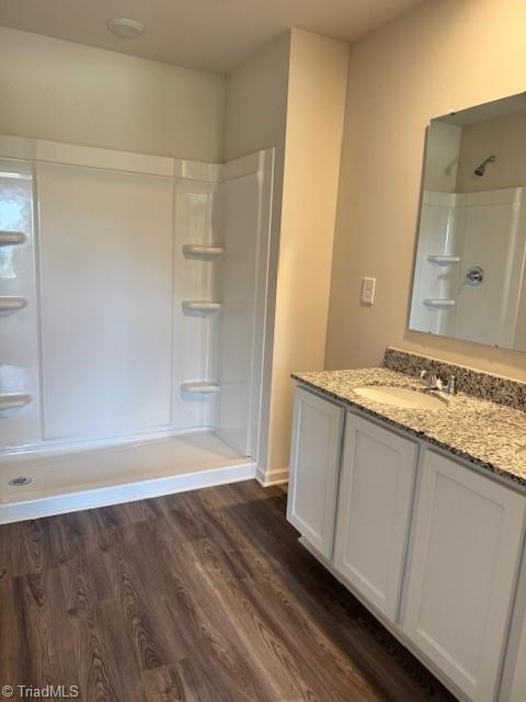 2210 Cranberry Way, Salisbury, NC 28147 - full bathroom featuring vanity, a shower, and wood finished floors
