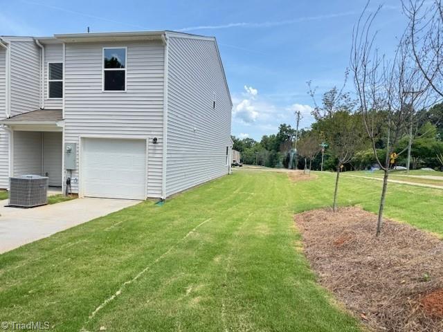 2210 Cranberry Way, Salisbury, NC 28147 - view of side of home with a lawn, driveway, and a garage