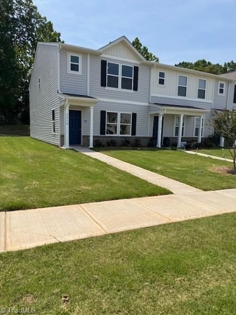 2210 Cranberry Way, Salisbury, NC 28147 - view of front facade with a front lawn, covered porch, and board and batten siding