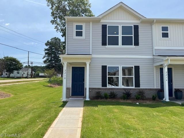 2210 Cranberry Way, Salisbury, NC 28147 - view of front of home with a front lawn, board and batten siding, and brick siding