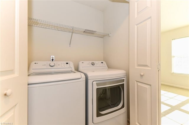 laundry area with washing machine and dryer and laundry area