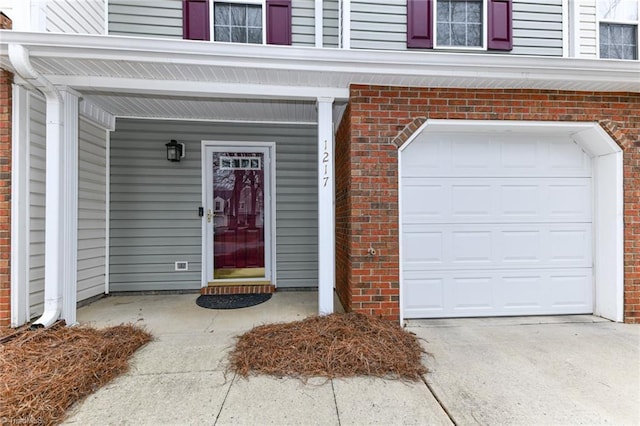 doorway to property with concrete driveway