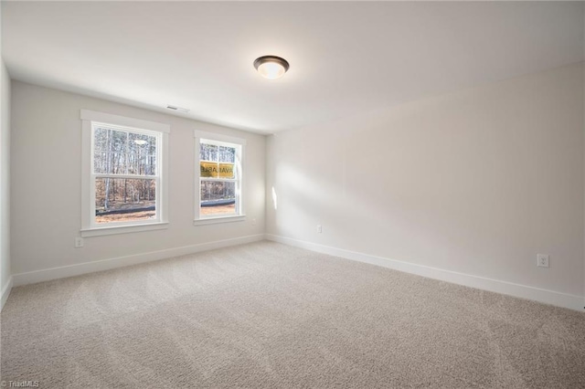 unfurnished room featuring carpet flooring