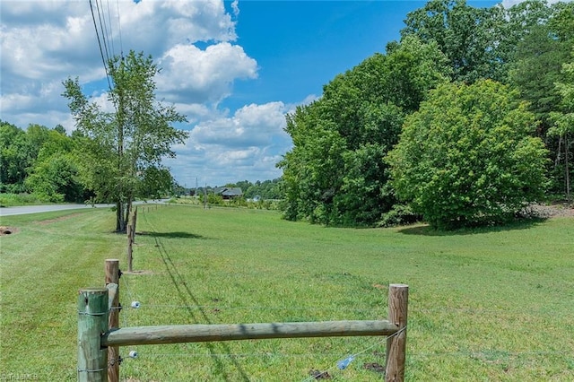 view of yard with a rural view