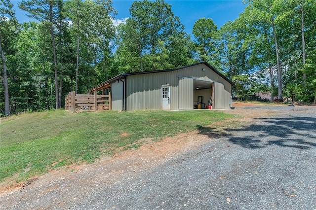 view of outdoor structure with a yard