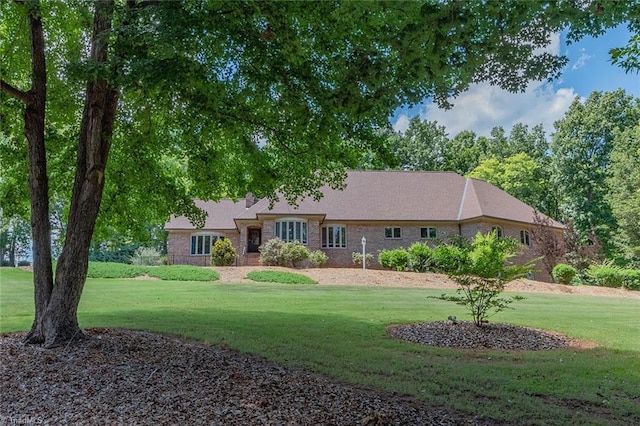 ranch-style house with a front lawn