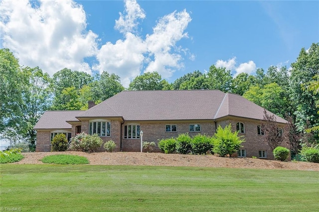 ranch-style house with a front yard