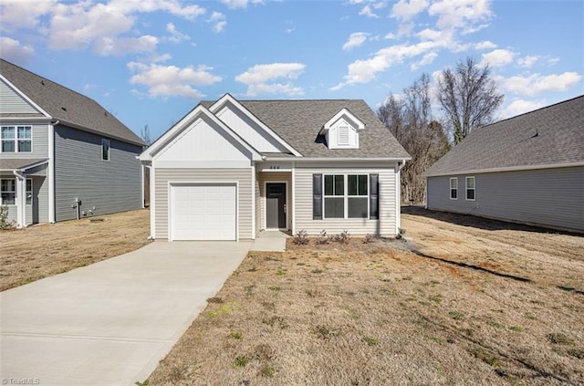 view of front of home with a garage and a front lawn