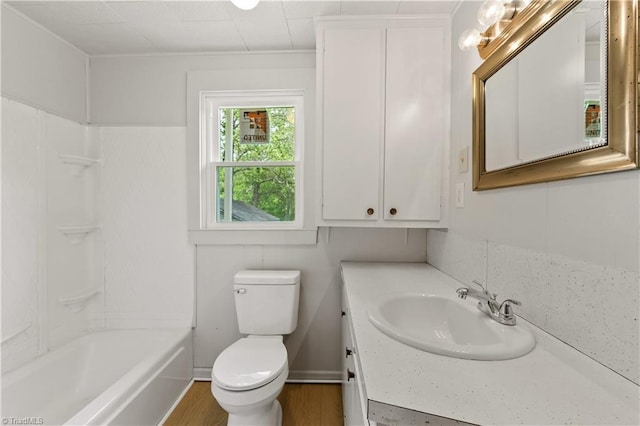 full bathroom with wood finished floors, vanity, toilet, and shower / bath combination