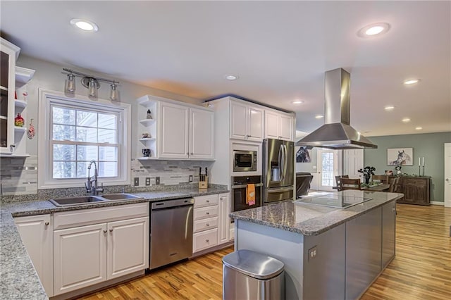 kitchen with open shelves, a sink, stainless steel appliances, white cabinetry, and island range hood