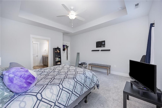 3903 Sudley Pt Unit 18, Jamestown, NC 27282 - bedroom featuring a tray ceiling, carpet flooring, ensuite bath, and ceiling fan