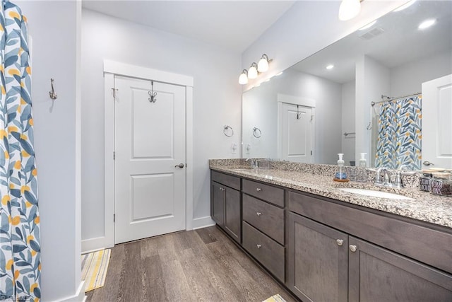 3903 Sudley Pt Unit 18, Jamestown, NC 27282 - full bath featuring wood finished floors, double vanity, and recessed lighting