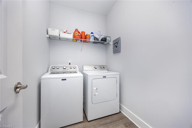 3903 Sudley Pt Unit 18, Jamestown, NC 27282 - washroom with washing machine and clothes dryer and wood finished floors