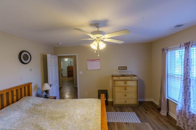 bedroom featuring ceiling fan and dark hardwood / wood-style floors