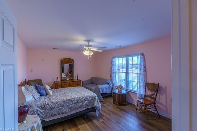 bedroom featuring dark hardwood / wood-style flooring and ceiling fan