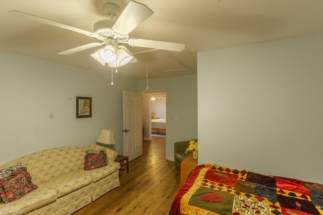 bedroom featuring wood-type flooring and ceiling fan