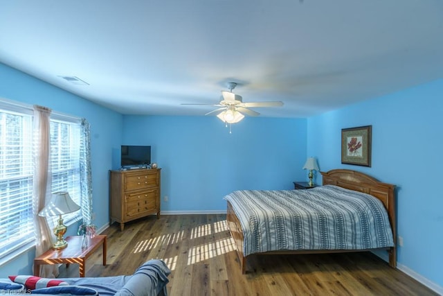 bedroom featuring dark wood-type flooring and ceiling fan