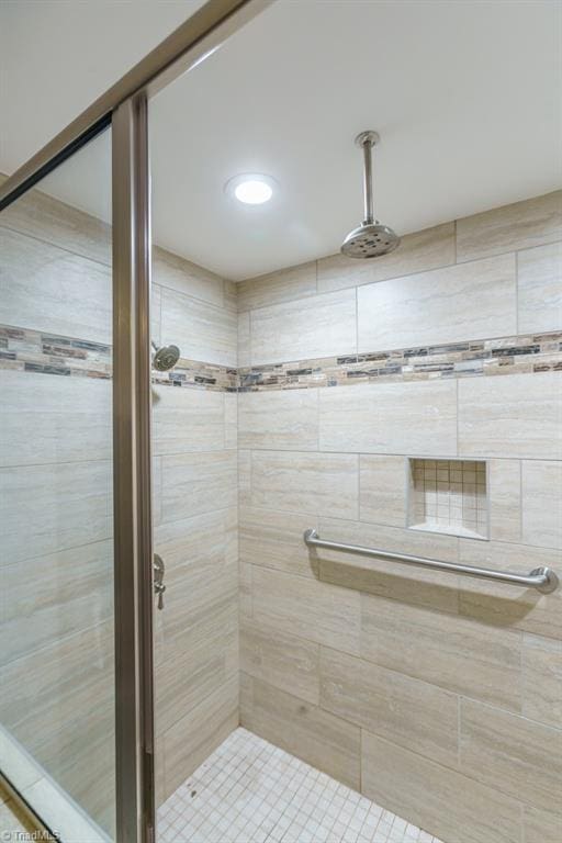 bathroom with a tile shower