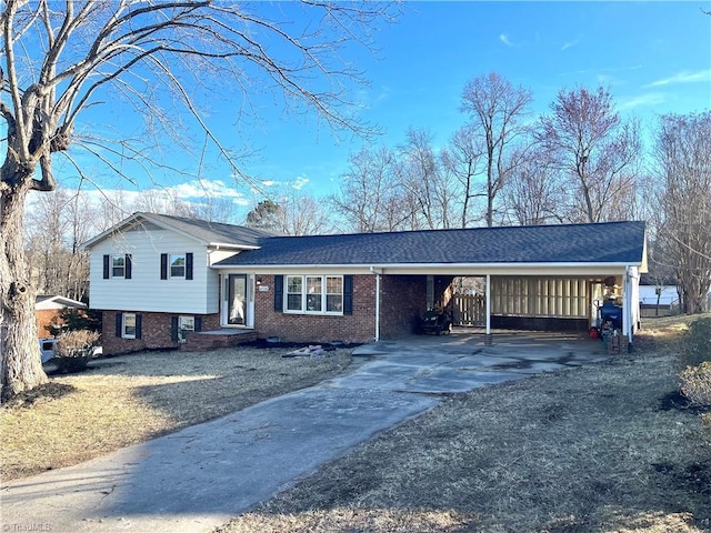 tri-level home featuring a carport