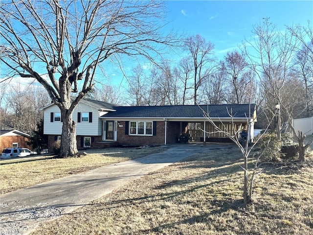 view of front facade with a carport and a front yard