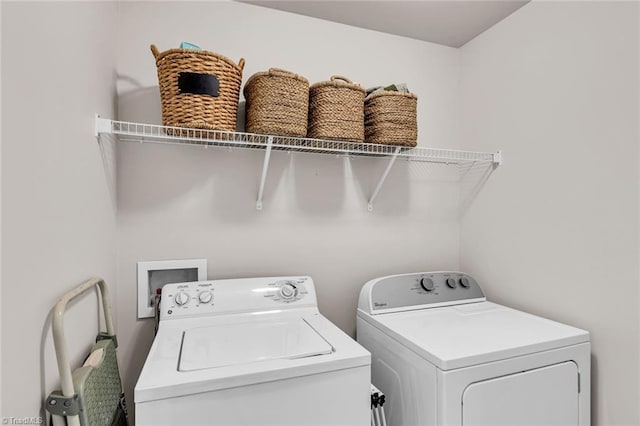 laundry area with laundry area and independent washer and dryer