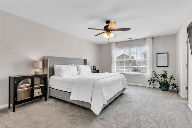 bedroom with carpet, visible vents, baseboards, and a ceiling fan