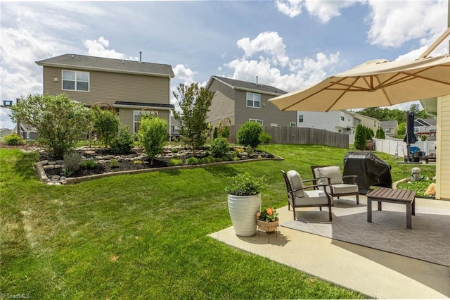 view of yard featuring a patio and fence