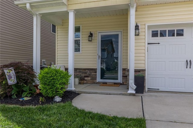 property entrance with stone siding and a porch