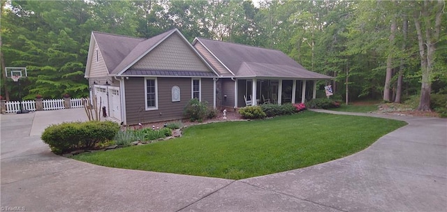 view of front of home featuring a garage and a front yard