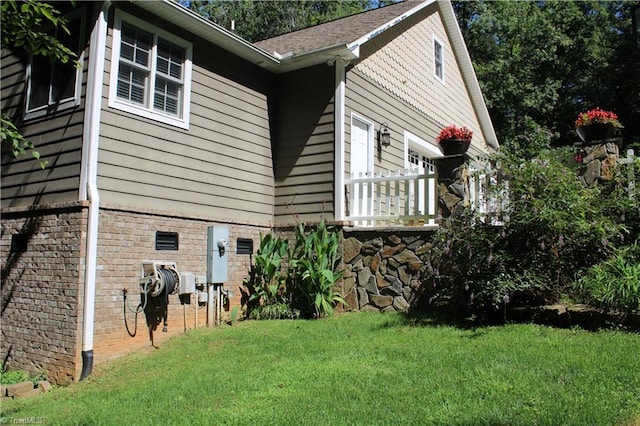 view of home's exterior with a lawn