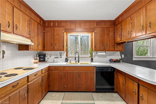 kitchen with a sink, under cabinet range hood, black dishwasher, light countertops, and white electric stovetop