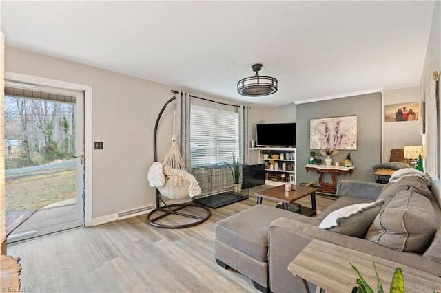 living area featuring baseboards and wood finished floors