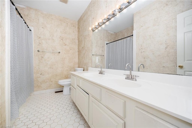 4904 Landaff Dr, Greensboro, NC 27406 - bathroom with toilet, double vanity, tile patterned floors, and a shower with shower curtain