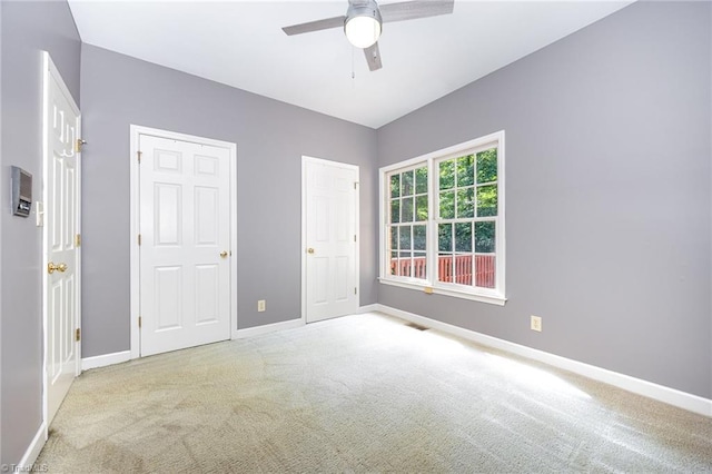 4904 Landaff Dr, Greensboro, NC 27406 - unfurnished bedroom featuring carpet floors, baseboards, and ceiling fan
