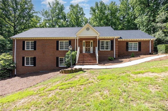 4904 Landaff Dr, Greensboro, NC 27406 - view of front facade featuring a front yard and brick siding