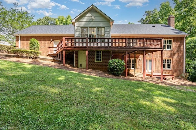 4904 Landaff Dr, Greensboro, NC 27406 - back of property featuring a deck, a lawn, a chimney, and brick siding