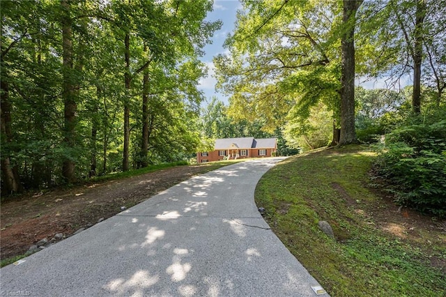 4904 Landaff Dr, Greensboro, NC 27406 - view of front of property featuring concrete driveway and a view of trees