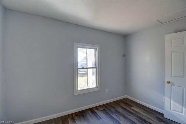 unfurnished room with dark hardwood / wood-style floors