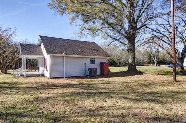 view of home's exterior with central AC unit and a lawn