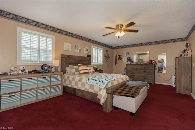bedroom featuring baseboards, a ceiling fan, and dark colored carpet