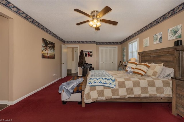 carpeted bedroom with baseboards, a textured ceiling, and ceiling fan