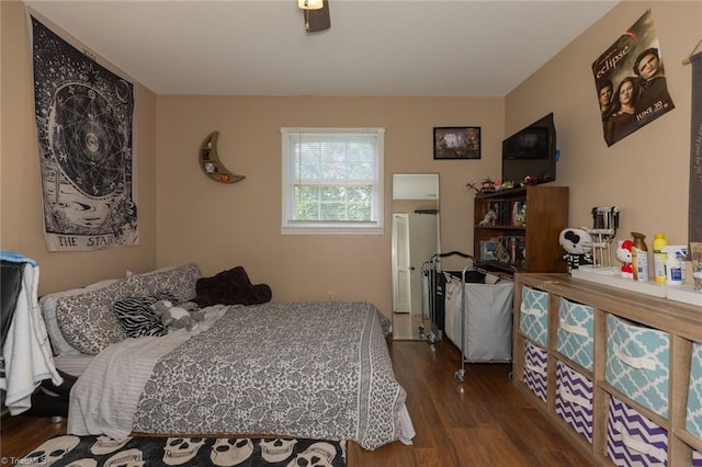 bedroom featuring wood finished floors